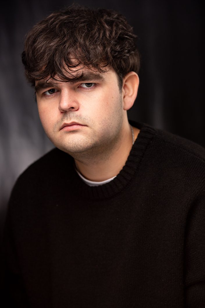 Luke Ayres, actor in 'Steve', sitting for his dramatic headshot.